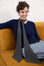 Cashmere Charcoal Skinny Scarf elegant charcoal cashmere skinny scarf styled with a navy knit for timeless everyday sophistication