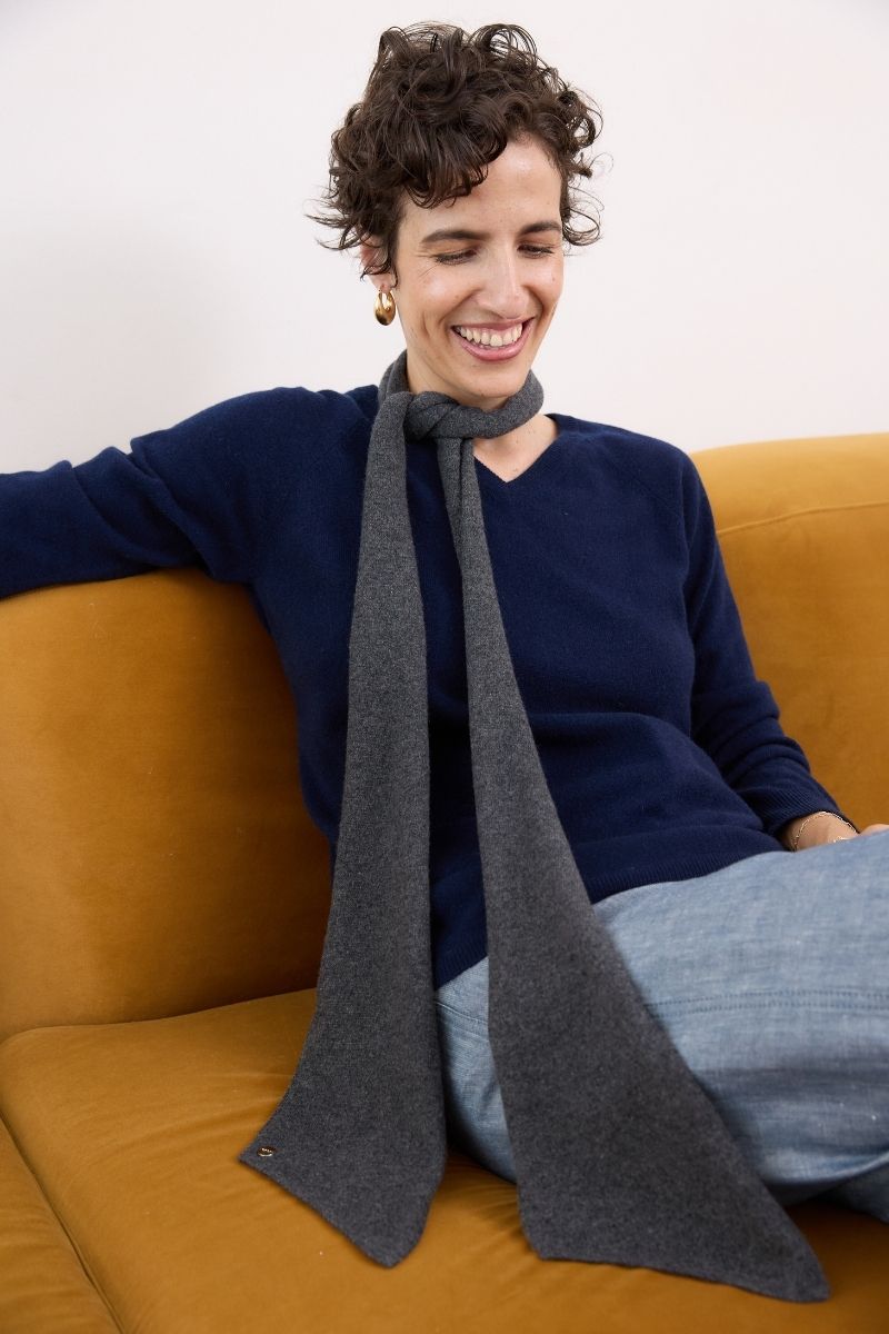 Cashmere Charcoal Skinny Scarf elegant charcoal cashmere skinny scarf styled with a navy knit for timeless everyday sophistication